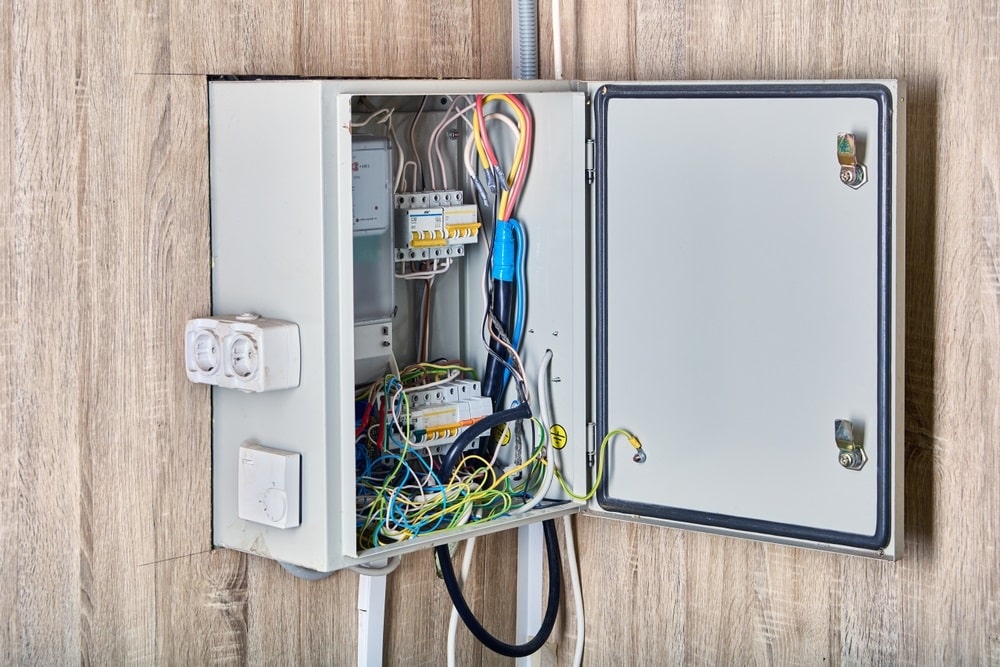 Professional Hot Shot Electric certified electrician upgrading breaker box – licensed Tulsa experts fix tripped breakers and install modern panels for safe home power.
