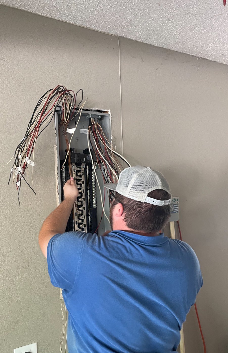 Hot Shot Electrical electrician upgrading a residential breaker panel